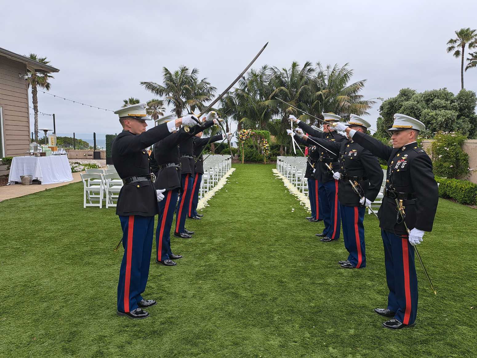 Marines raise their swords at a military wedding