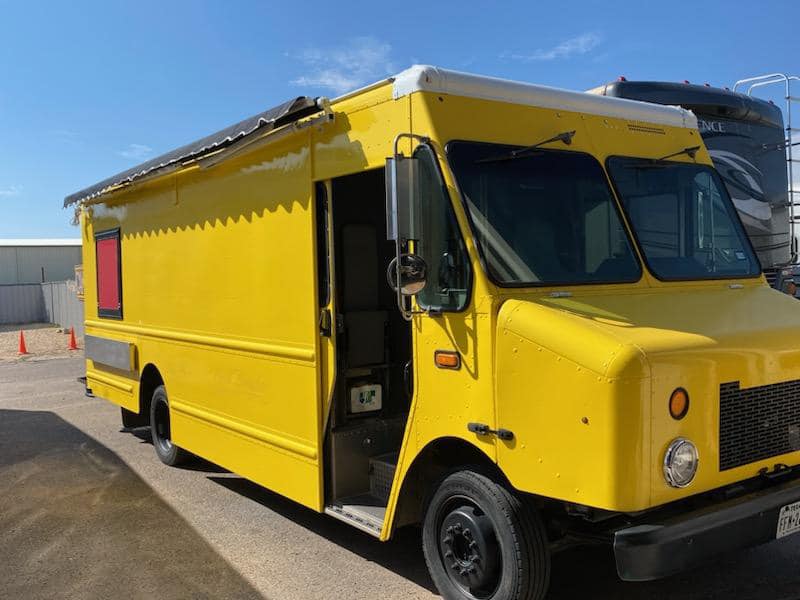 Yellow food truck parked at ZAZ RV & Marine Service Center.