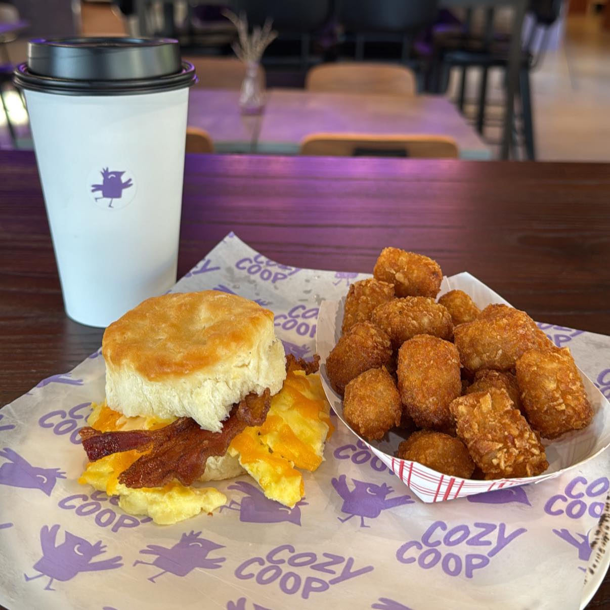 breakfast sandwich, tots, and coffee