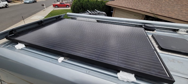 The view of an RV top with solar panels.