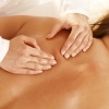 Massage therapist massaging their client's back.