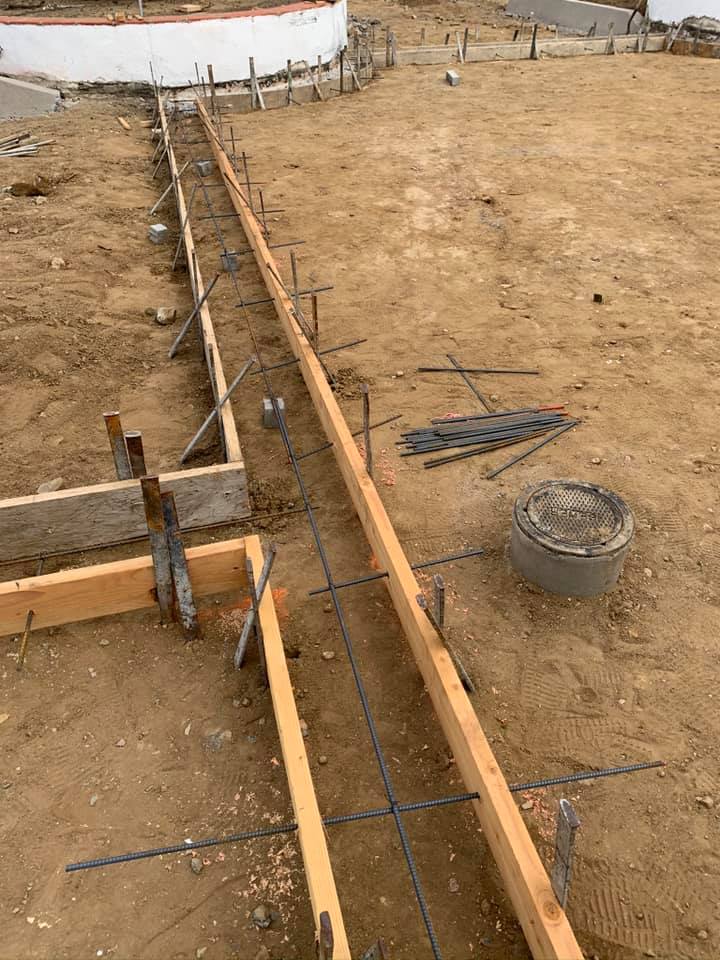 Sections of 2x4s are put in place as guides for pouring concrete.
