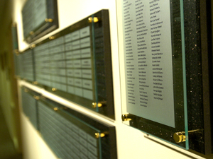 A row of interior plaques on a wall.