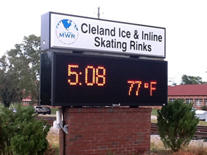Outdoor signage pedestal for Cleland Ice & Inline Skating Rinks with an LED screen for time and temperature.