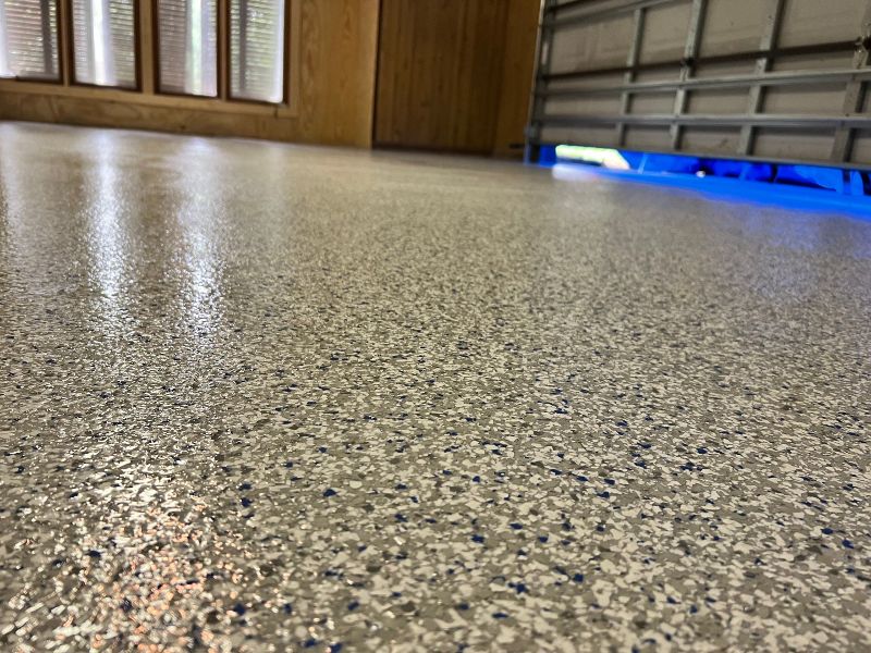 Brown and gray speckled garage floor.