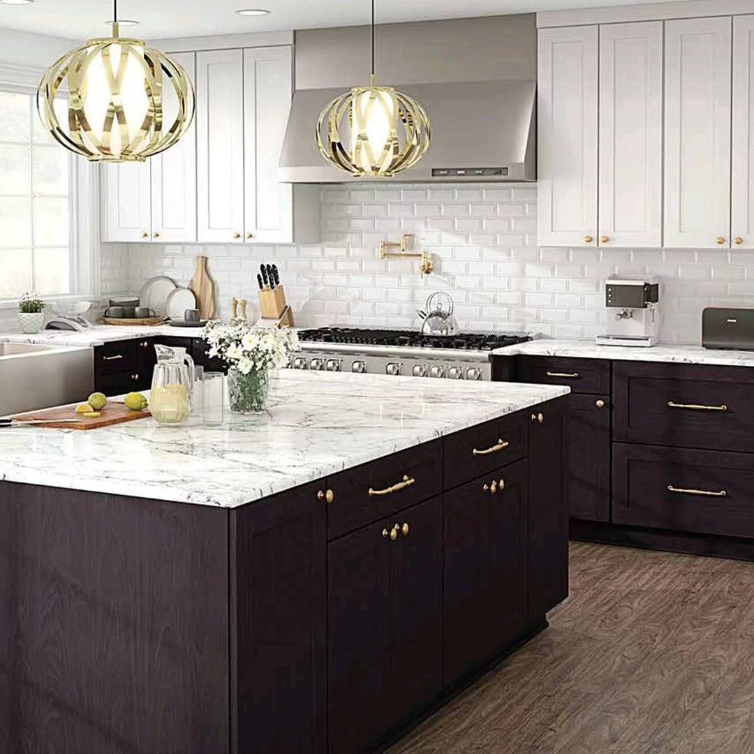 A stylish kitchen with white walls and uppers, dark lowers