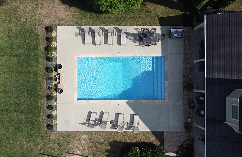 A aerial view of a backyard swimming pool