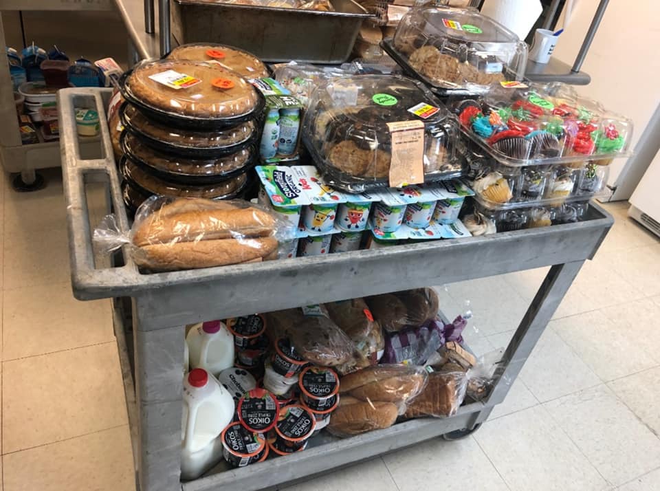 Cart stacked with food to be served at breakfast.
