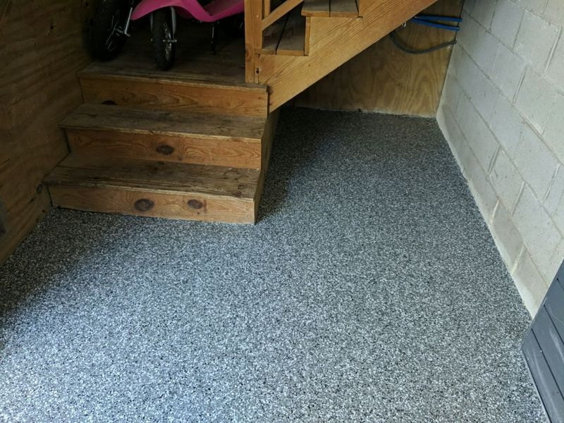 Gray and black speckled floor coating.