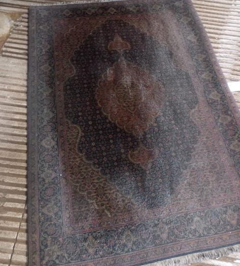 A rug before restoration