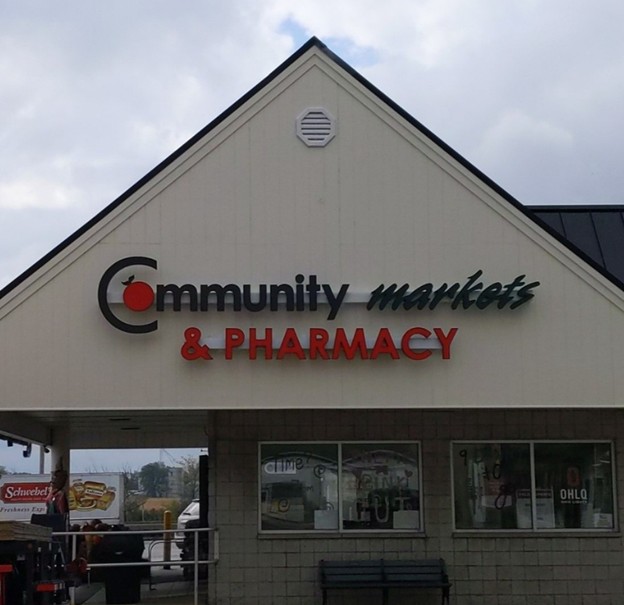 Community Markets & Pharmacy sign