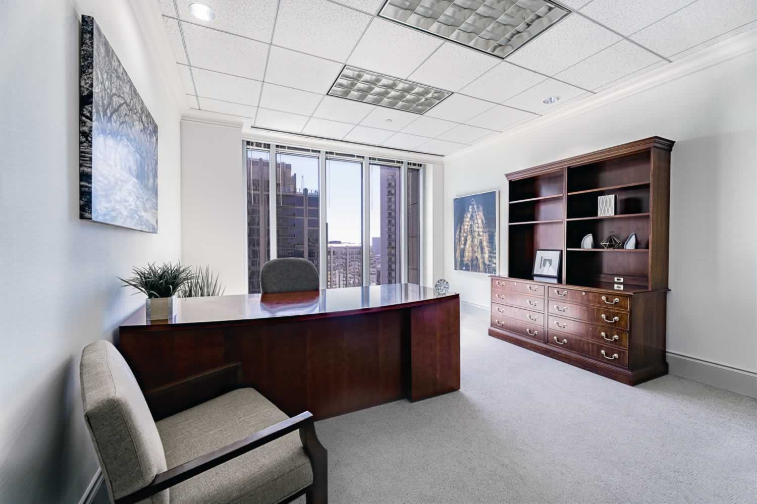 An attractive office with a sliding glass door.