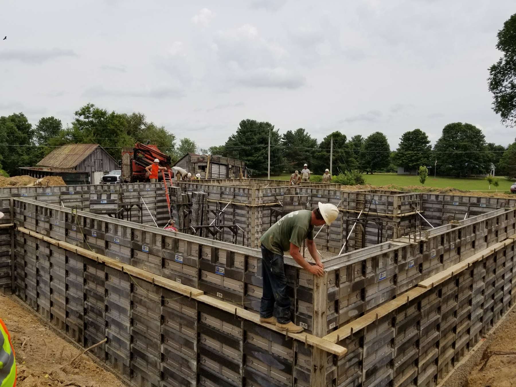 Workers building a barn