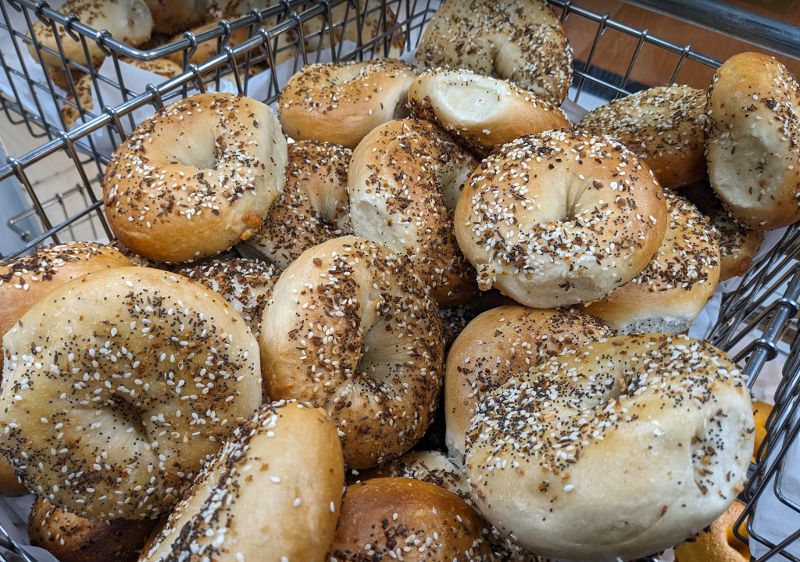 A basket of seeded bagels.