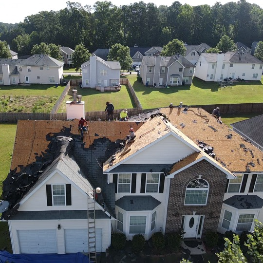 Large family home undergoing major roof replacement services.
