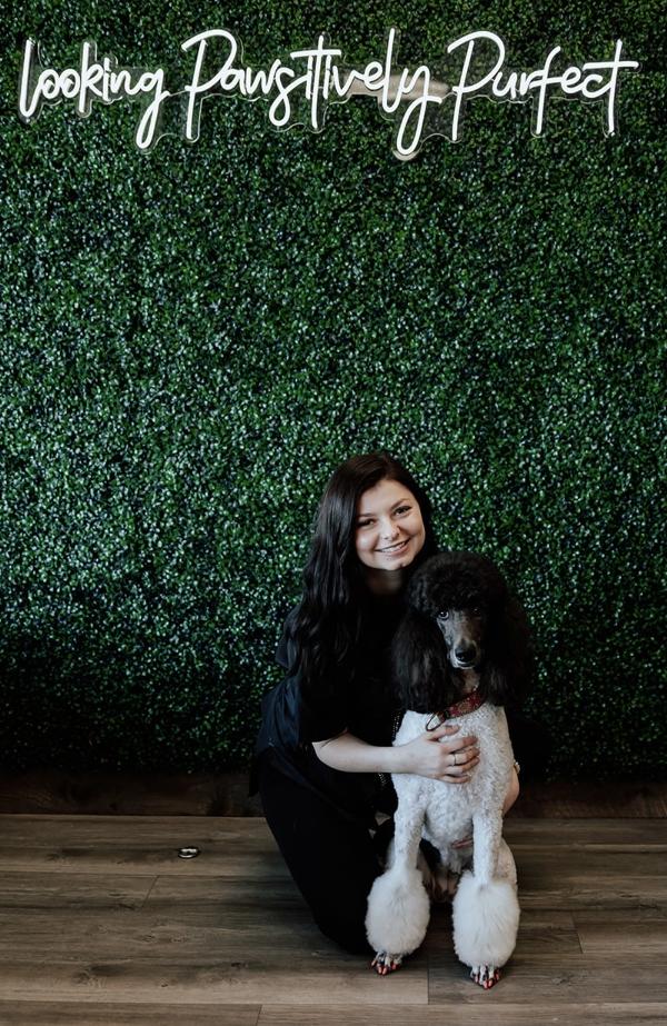 Faith posing with a dog