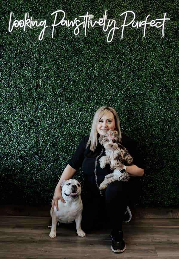 Teri posing with two dogs