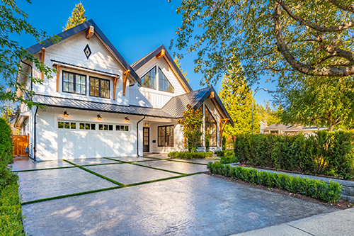 Gorgeous stamped concrete driveway outside a stunning home.
