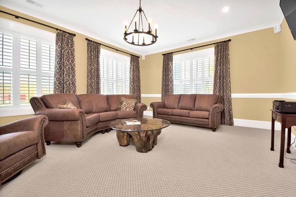 A living room with two sofas and a chair