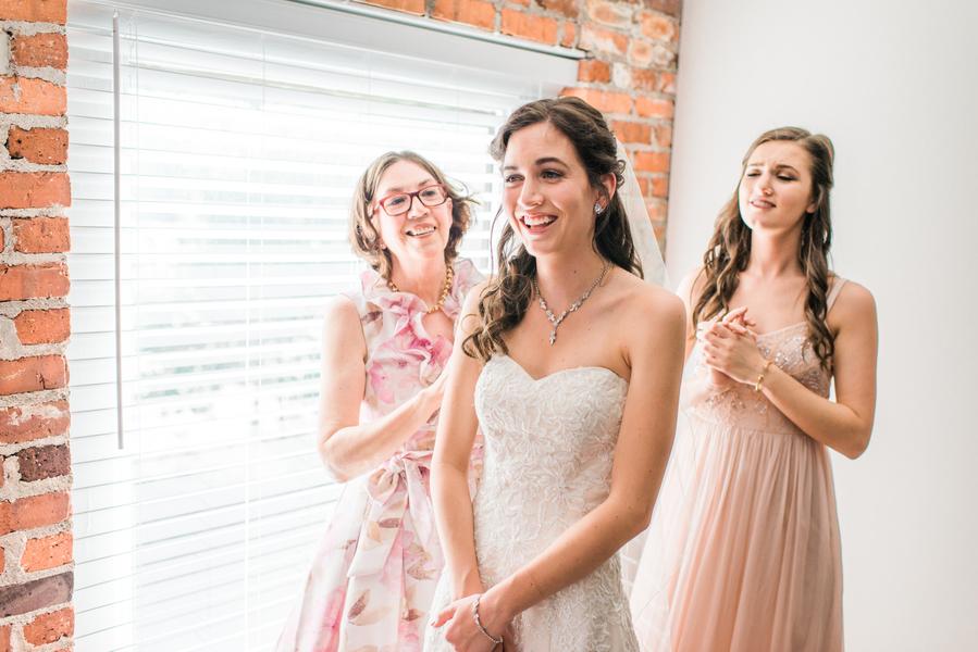 A young bride and her bridesmaids prepare for a wedding