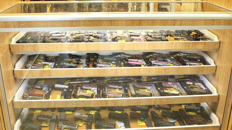 Display racks of handguns.