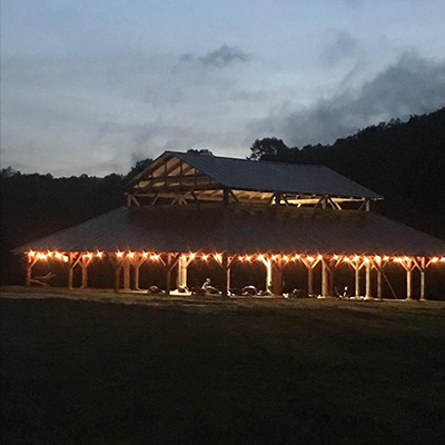 Wedding venue lit for evening reception.