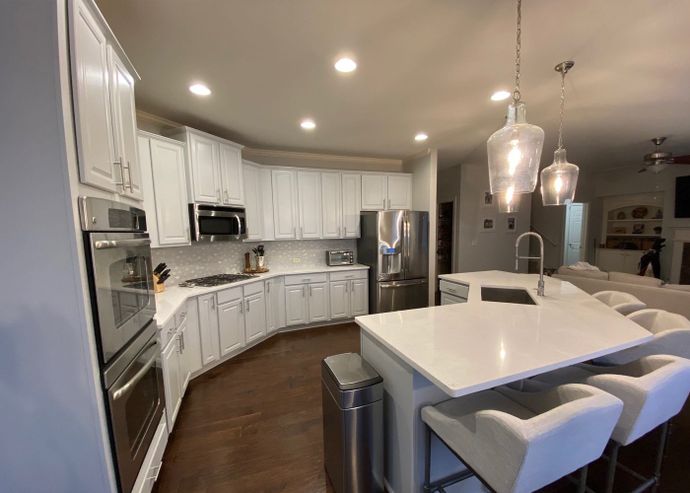 Modern kitchen with white cabinetry.