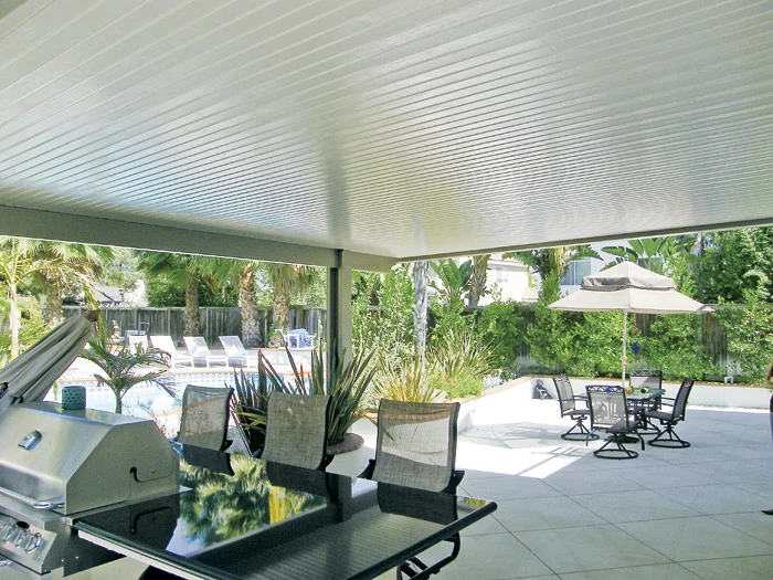 patio cover over outdoor grill with tables