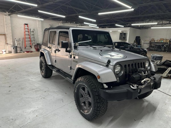 Gray Jeep in a shop
