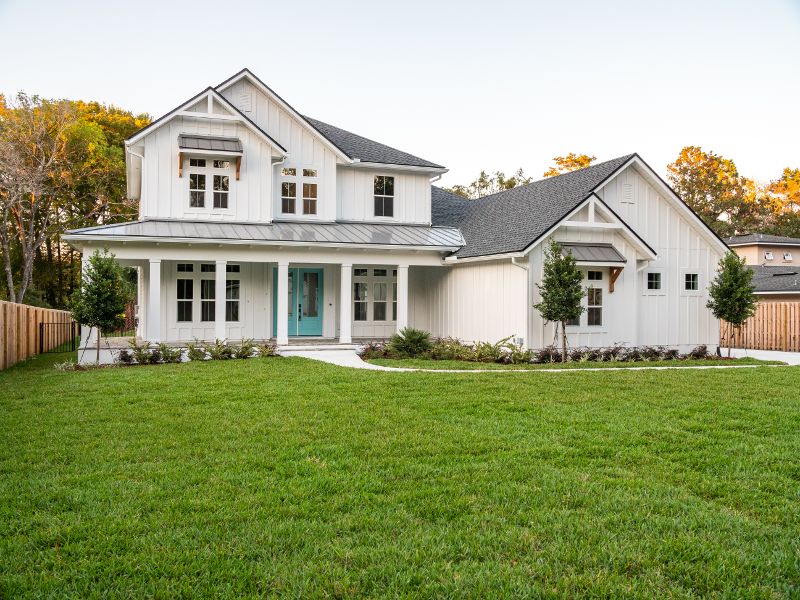 A two-story white frame home with attached garage.