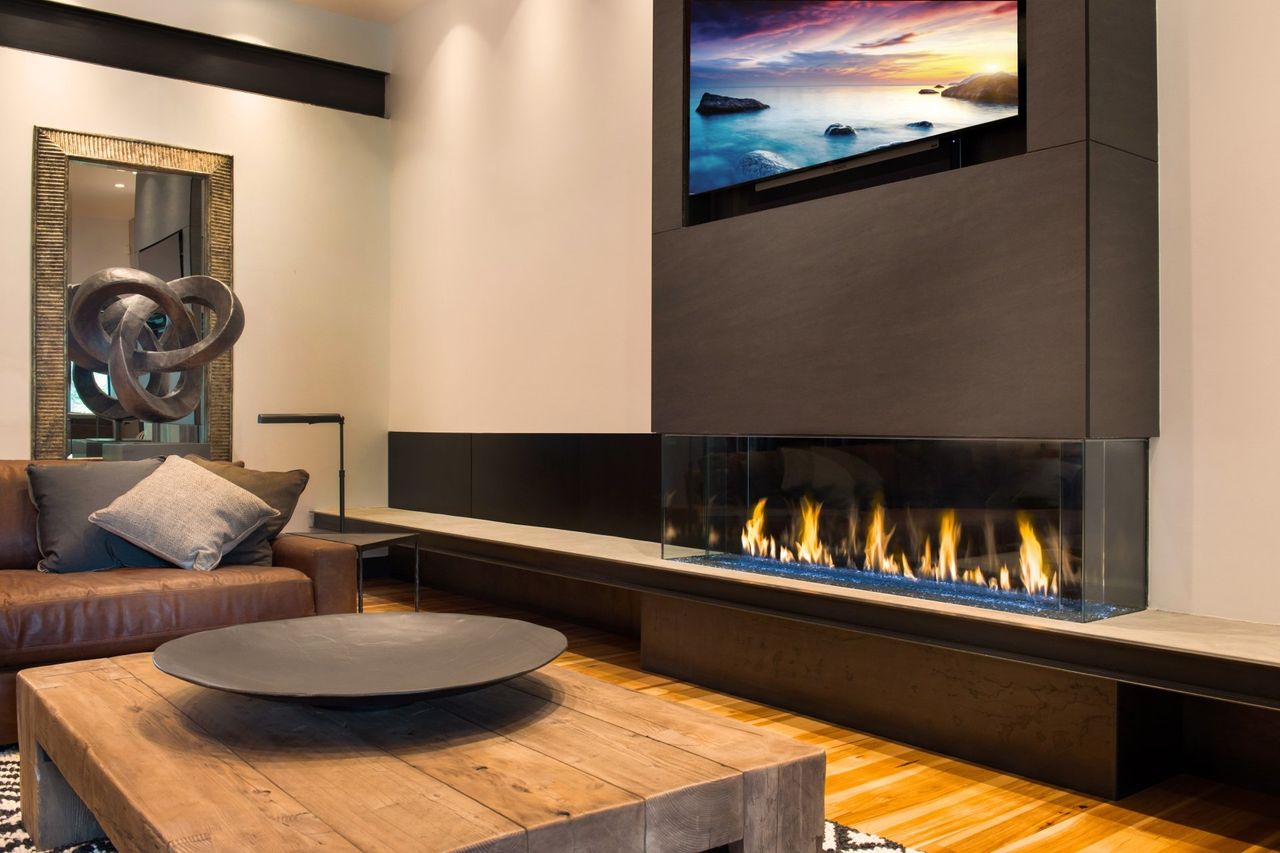 Fireplace installed under a television.