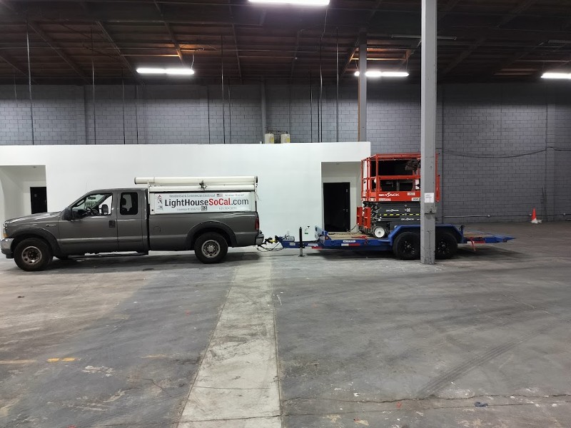 Light House Electrical company truck parked in a newly built industrial warehouse.