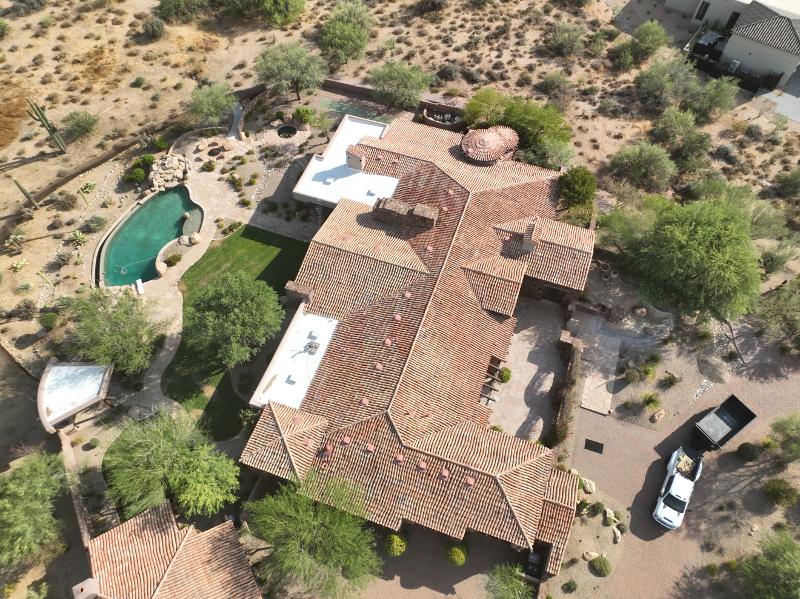Aerial view of a large residential roof.