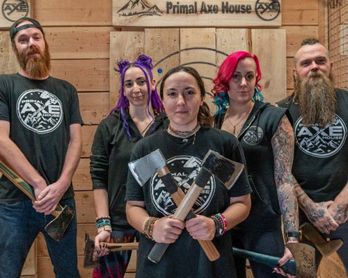 Five employees of Primal Axe House pose for a photo.