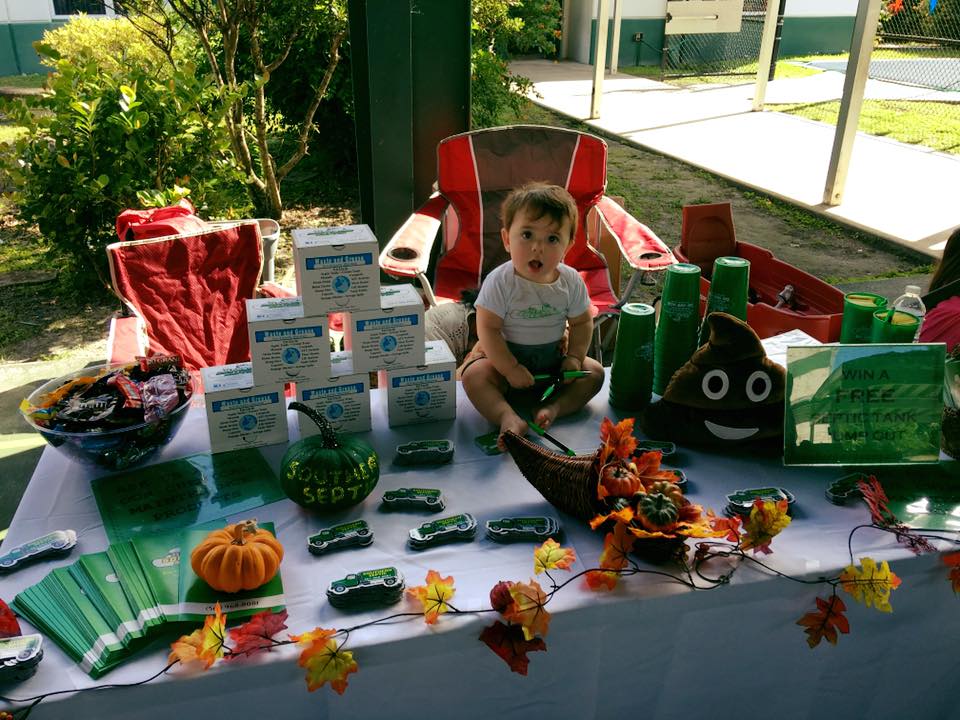 A young boy plays among septic products.