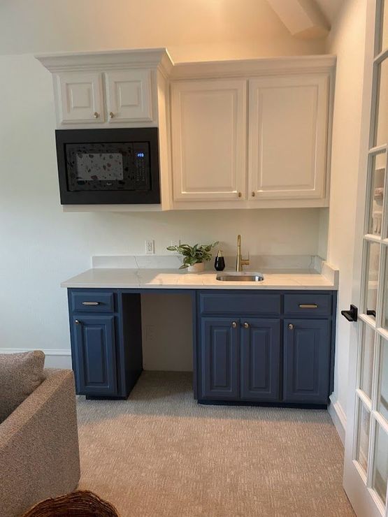 kitchen area with built-in microwave