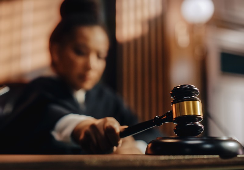 Female judge lowers a gavel