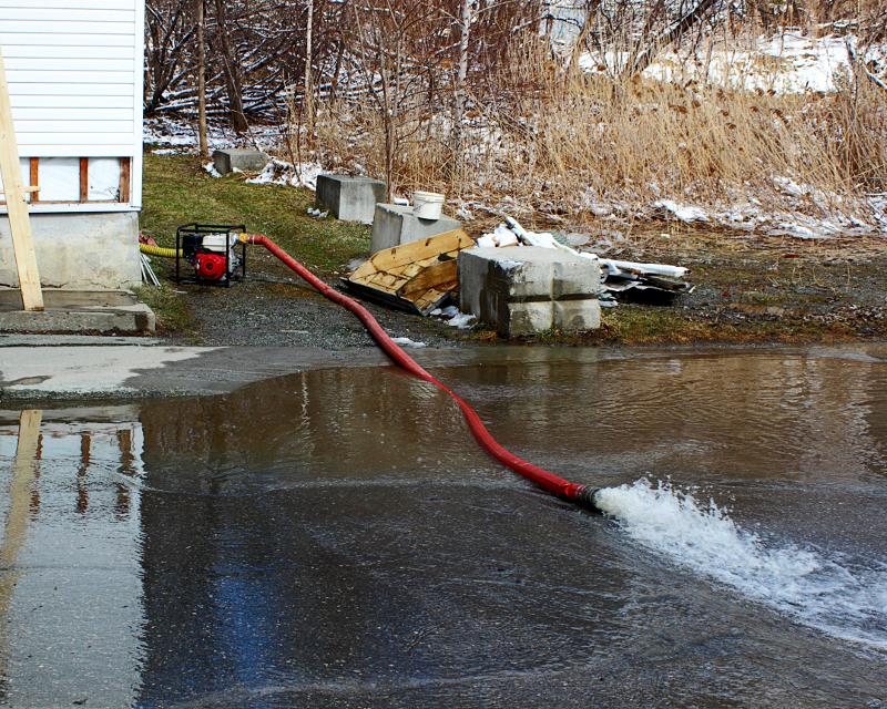 Water pumped out of a home and onto the st