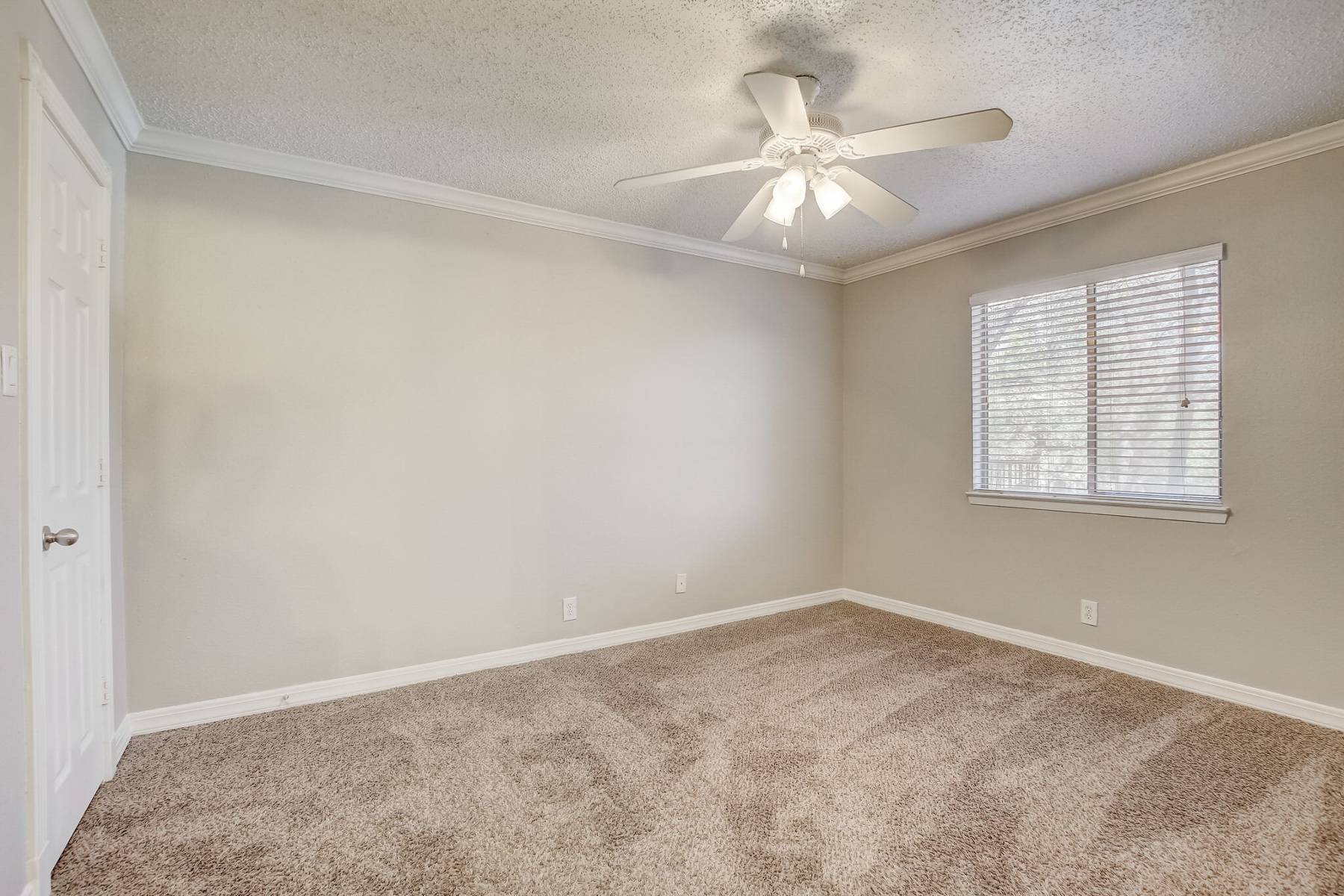 An open bedroom of an apartment.