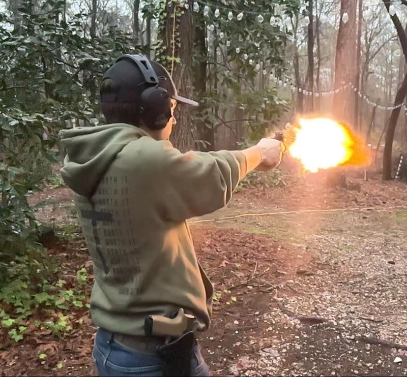 man shooting a gun