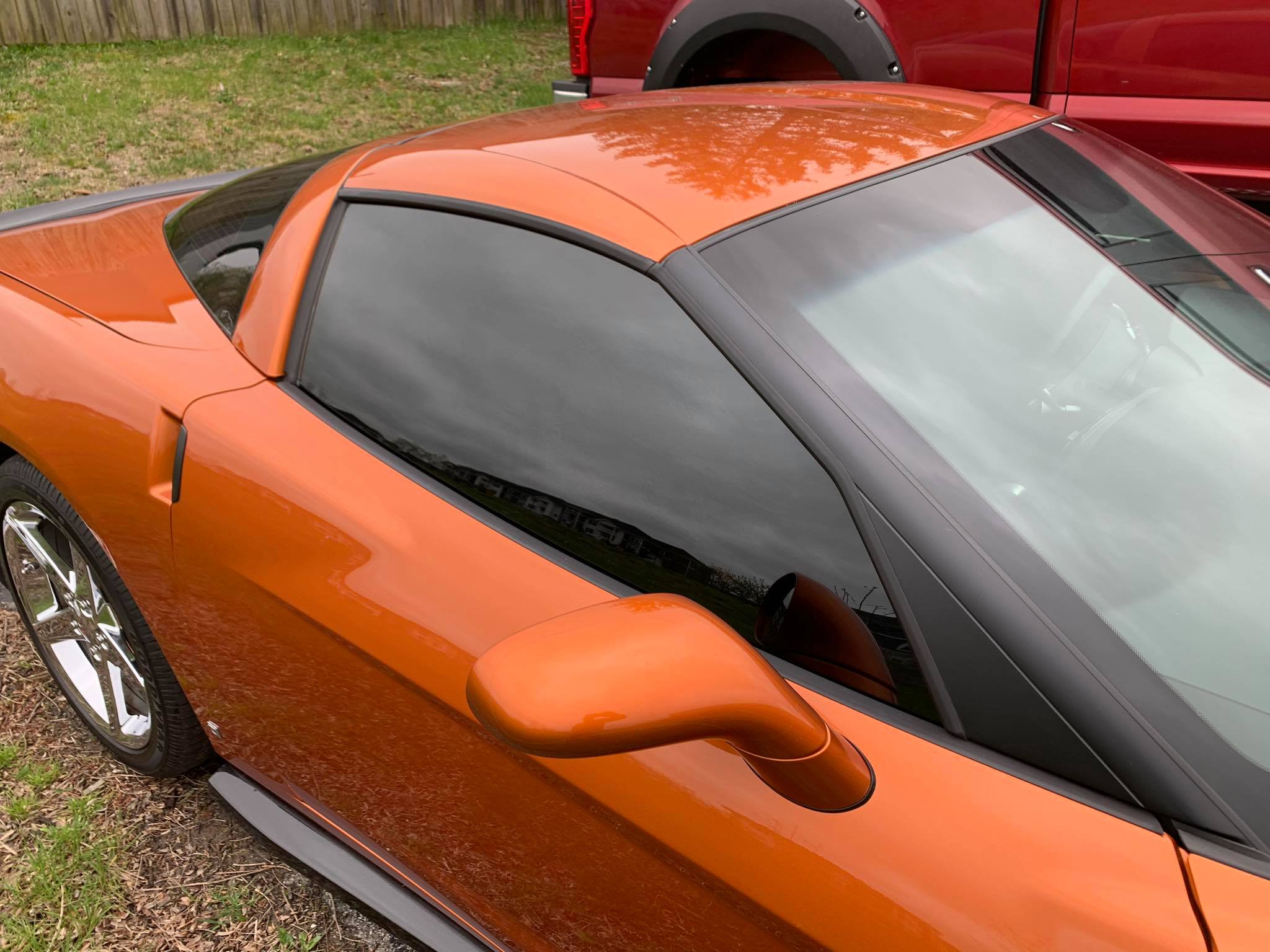 Orange sports car with window tint