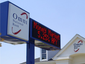 Tall signage for Omni National Bank with an LED message screen.