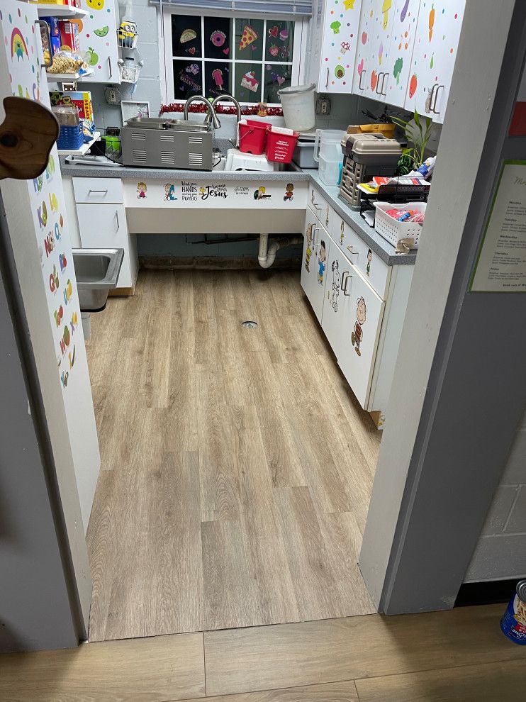 Luxury vinyl flooring in a kitchen area.