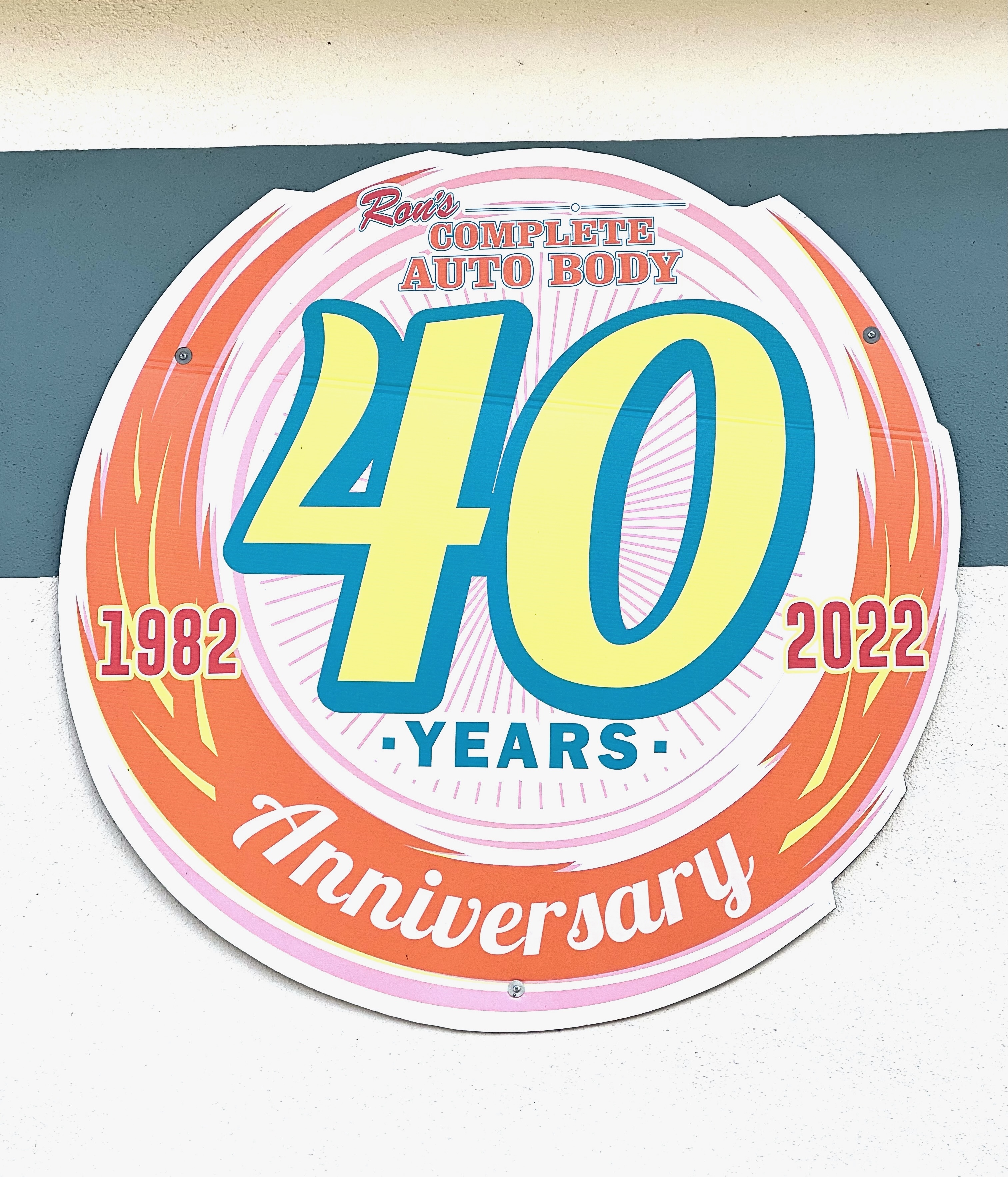 40-year anniversary badge for Ron's Complete Auto Body