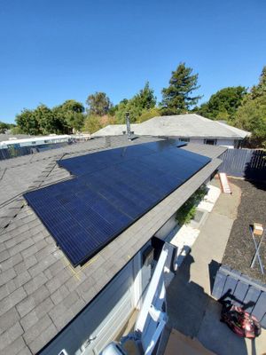 Solar panels on a shingle roof.