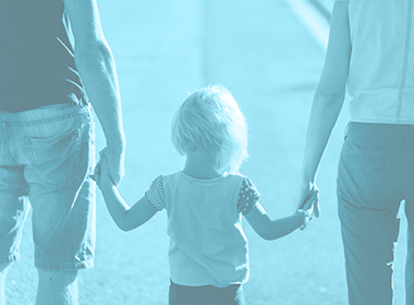 child holding their parents hands