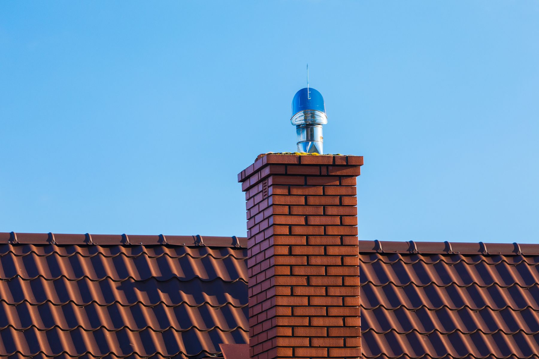 A new, red-brick chimney