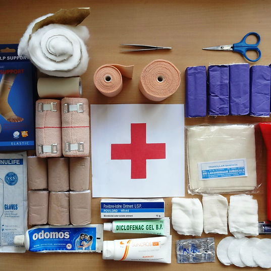 first aid supplies laid out on a table