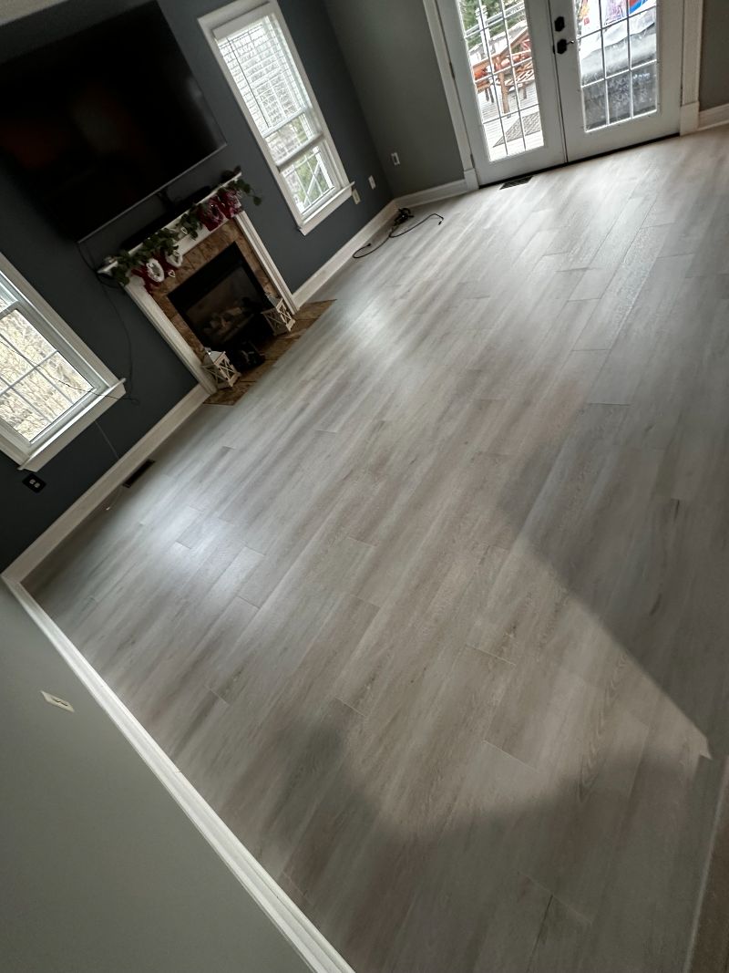 Living room with grey flooring.