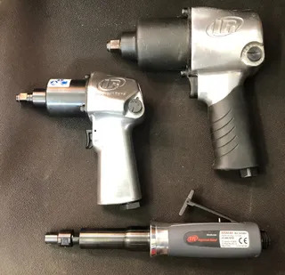 Three air-driven drill/drivers.